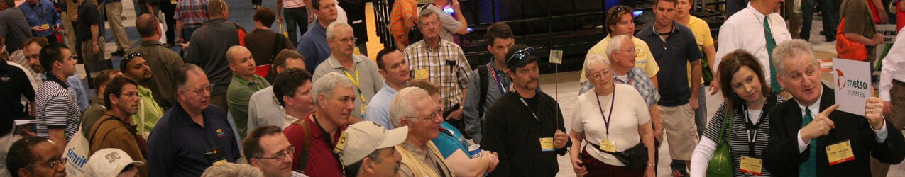 trade show presenter magician attracts crowd